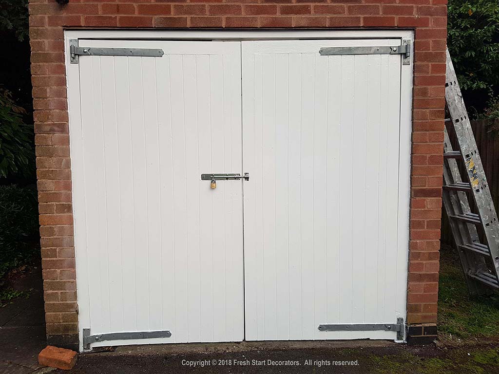 Exterior garage doors painted by fresh start decorators